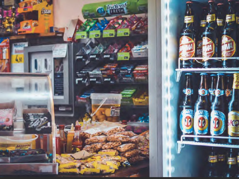 Glass-door beverage cooler stocked with drinks in a store